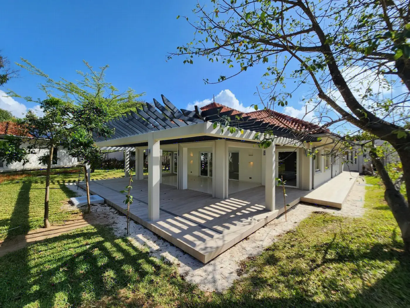 Villa with pergola terrace under the trees at Maya Ilai